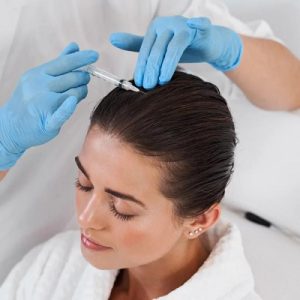 Woman receiving exosome hair therapy injection for hair loss treatment at Capella Esthetics Islamabad